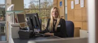 Woman sitting down at office desk