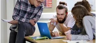 students looking at a laptop