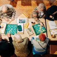 senior people playing Gaelic Scrabble  