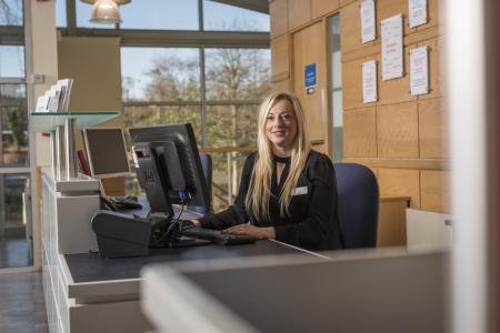 Woman sitting down at office desk