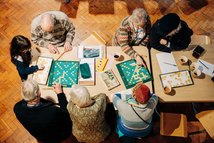 senior people playing Gaelic Scrabble  