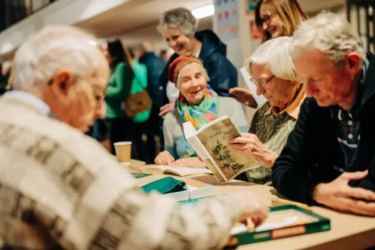 senior people reading gaelic books