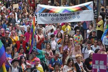 A pride march with lots of people